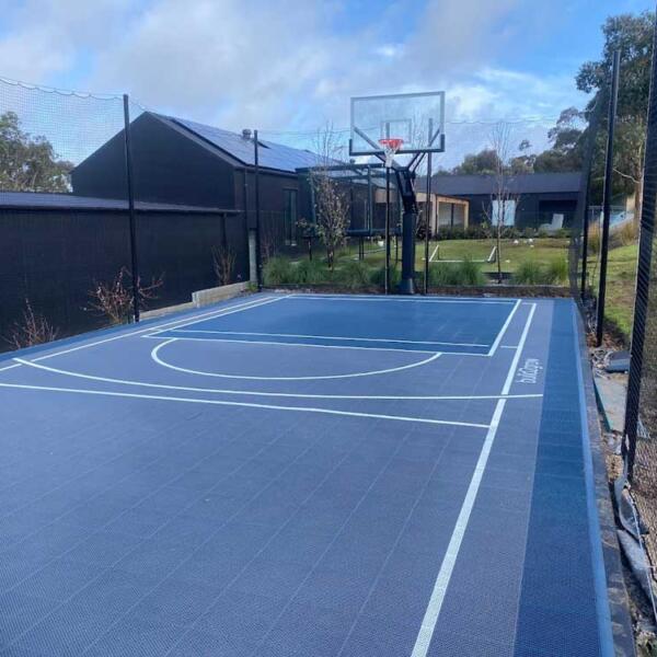 Multi-sport court tiles for basketball, pickleball, and soccer in Jan Juc
