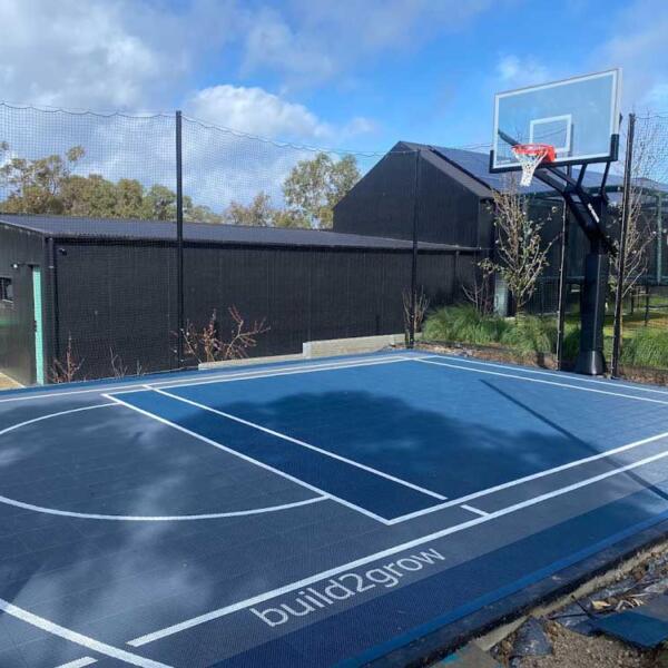 Multi-sport court tiles for basketball, pickleball, and soccer in Jan Juc