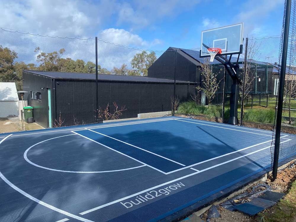 Multi-sport court tiles for basketball, pickleball, and soccer in Jan Juc