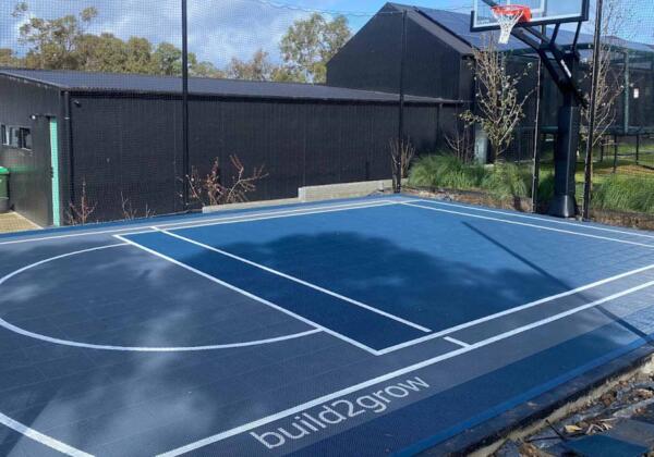 Multi-sport court tiles for basketball, pickleball, and soccer in Jan Juc