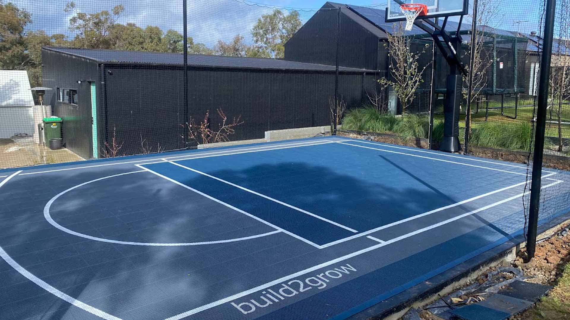 Multi-sport court tiles for basketball, pickleball, and soccer in Jan Juc