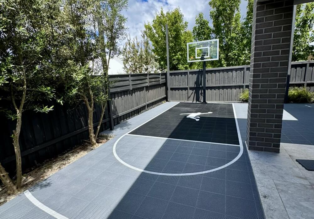 Custom Slam Man basketball court installed over an existing backyard concrete area in Torquay