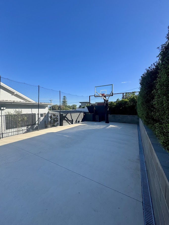 Before sports court installation plain concrete area