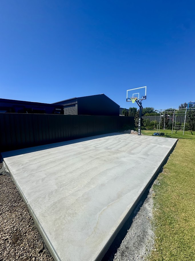 Before backyard basketball court installation area