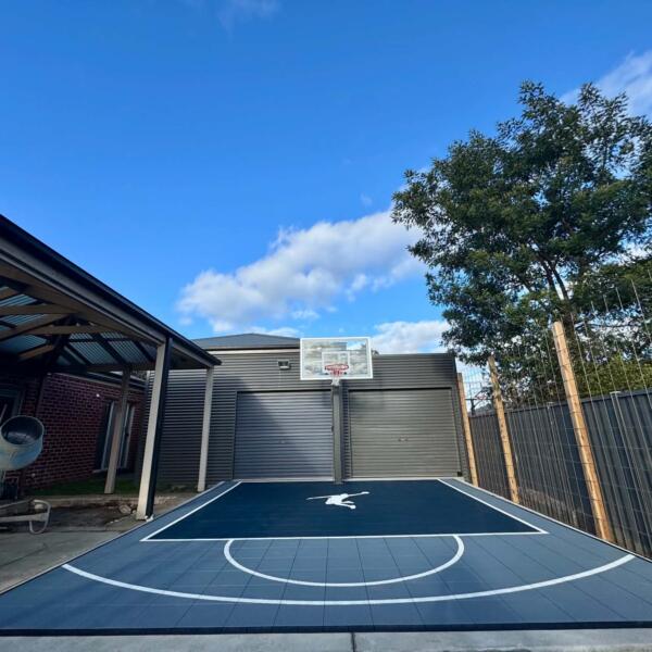 Slam Man basketball court with charcoal blue key and light grey outer in Ballarat