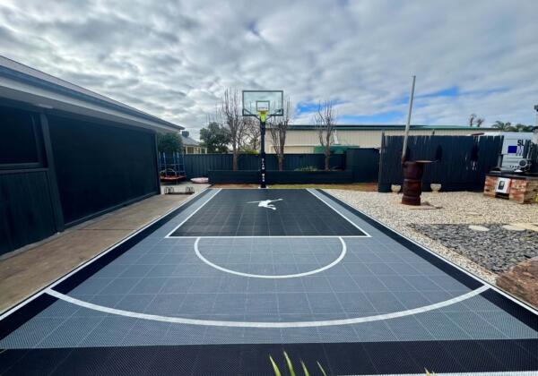 Custom backyard basketball court in Swan Hill Victoria with Slam Man Elite 60 inch ring and glow in the dark lines