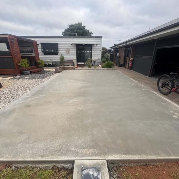 Before photo of backyard space prepared for custom Slam Man basketball court in Swan Hill