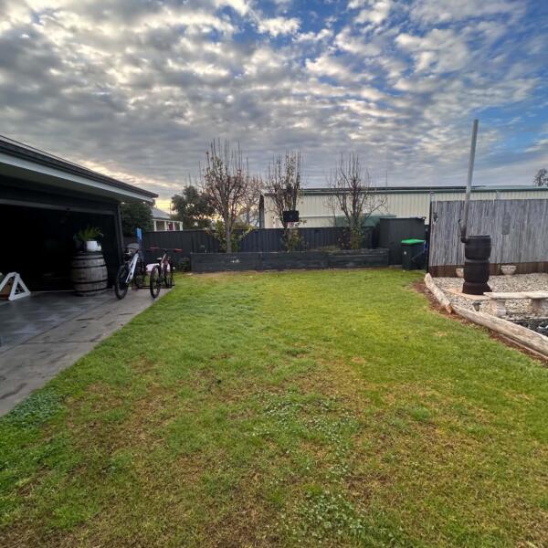 Before photo of backyard space prepared for custom Slam Man basketball court in Swan Hill