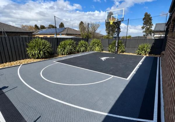 Custom Slam Man Pro Cushion basketball court with Elite 60 inch ring and fence net kits in Melton