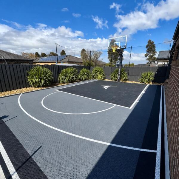 Custom Slam Man Pro Cushion basketball court with Elite 60 inch ring and fence net kits in Melton