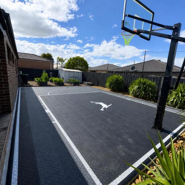 Backyard Slam Man basketball court custom fitted beside home in Melton Victoria