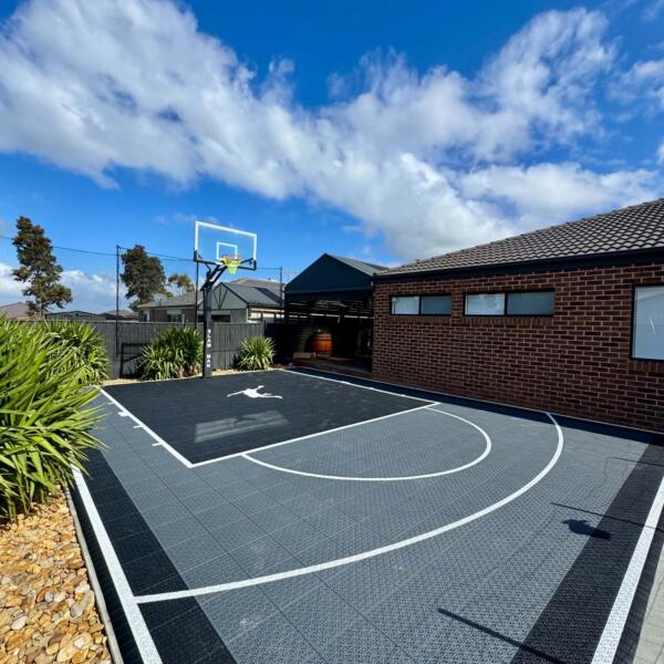 Backyard Slam Man basketball court custom fitted beside home in Melton Victoria