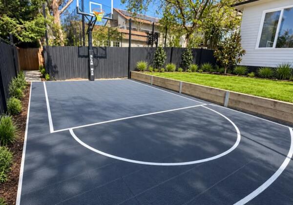 Custom Slam Man Elite basketball court with 60 inch ring installed in Rosanna
