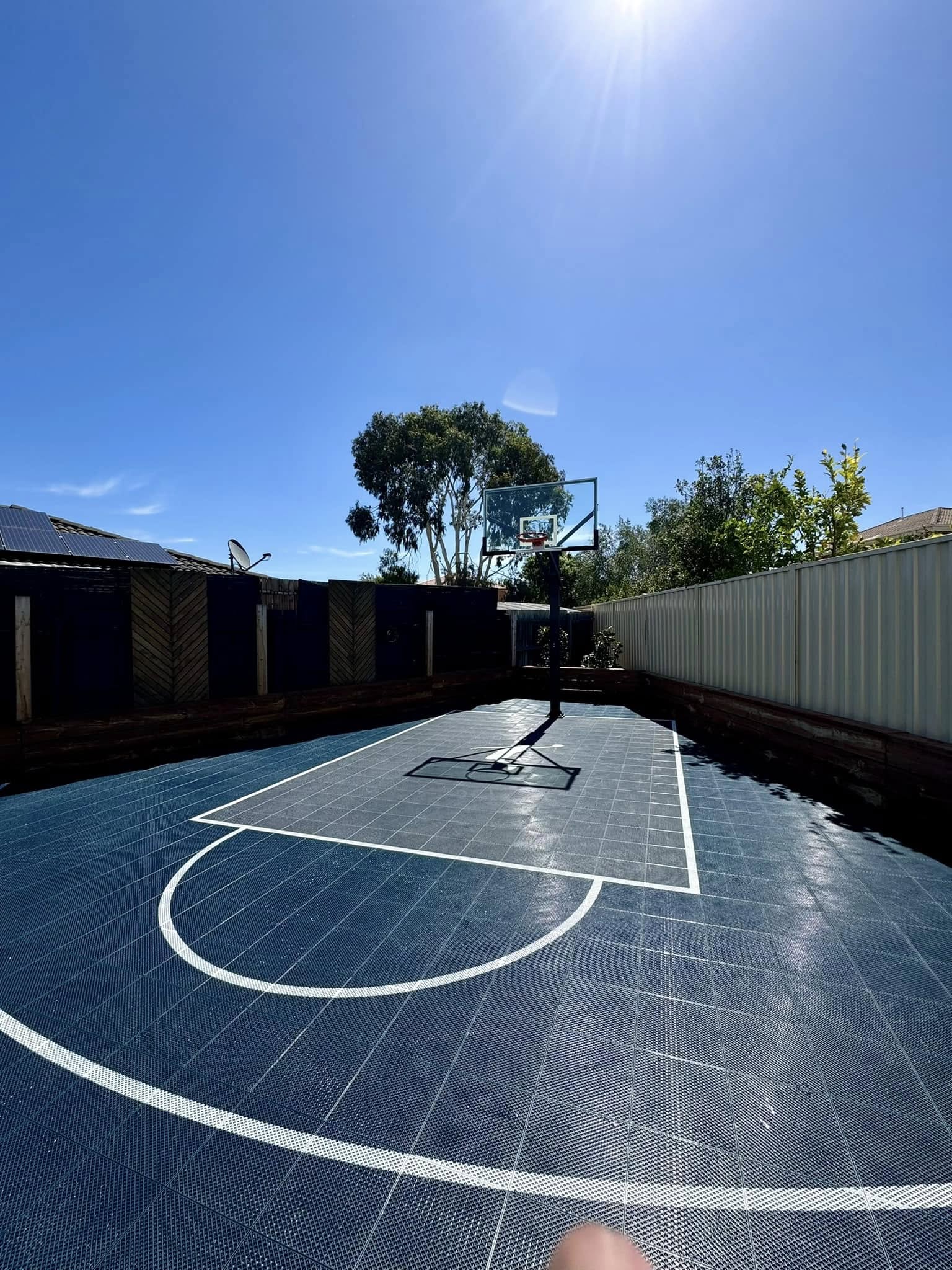 Custom Slam Man basketball court installed over an existing backyard area in Taylors Lakes
