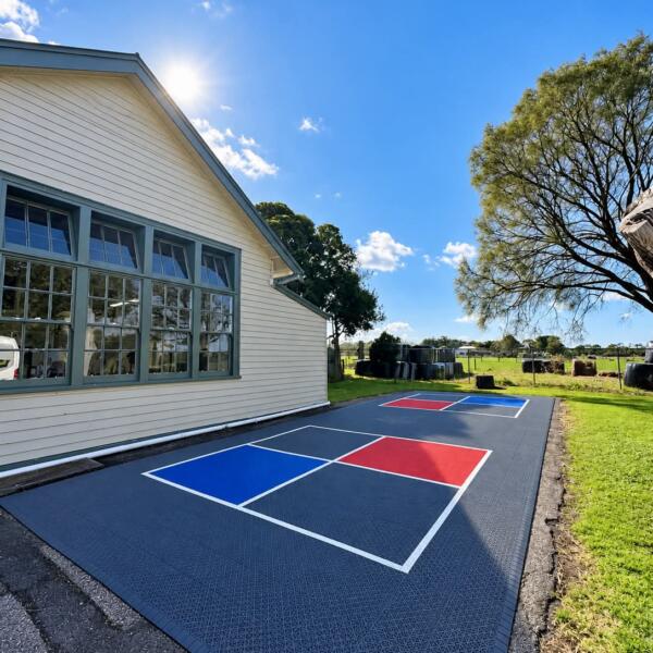 Slam Man Pro Cushion 4 square courts with red and blue play areas at Welshpool Primary School