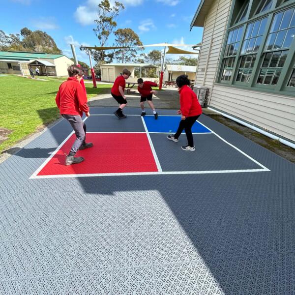 Students playing on new 4 square courts at Welshpool and District Primary School