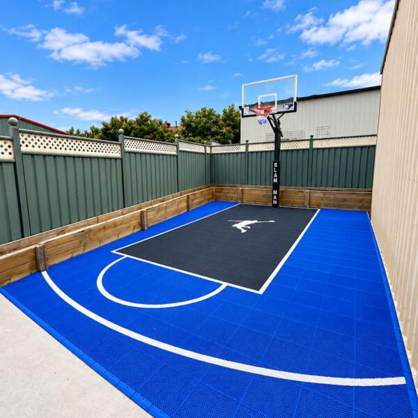 Custom Slam Man basketball court at Zoe's Family Day Care in Hamilton VIC, with blue and grey sports tiles and 60-inch basketball ring.