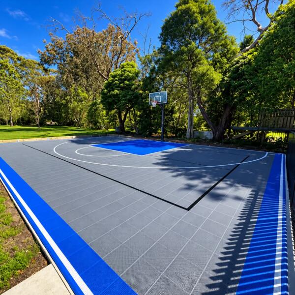 Slam Man Elite multi sport court on the Mornington Peninsula with basketball ring blue border and custom pickleball line marking